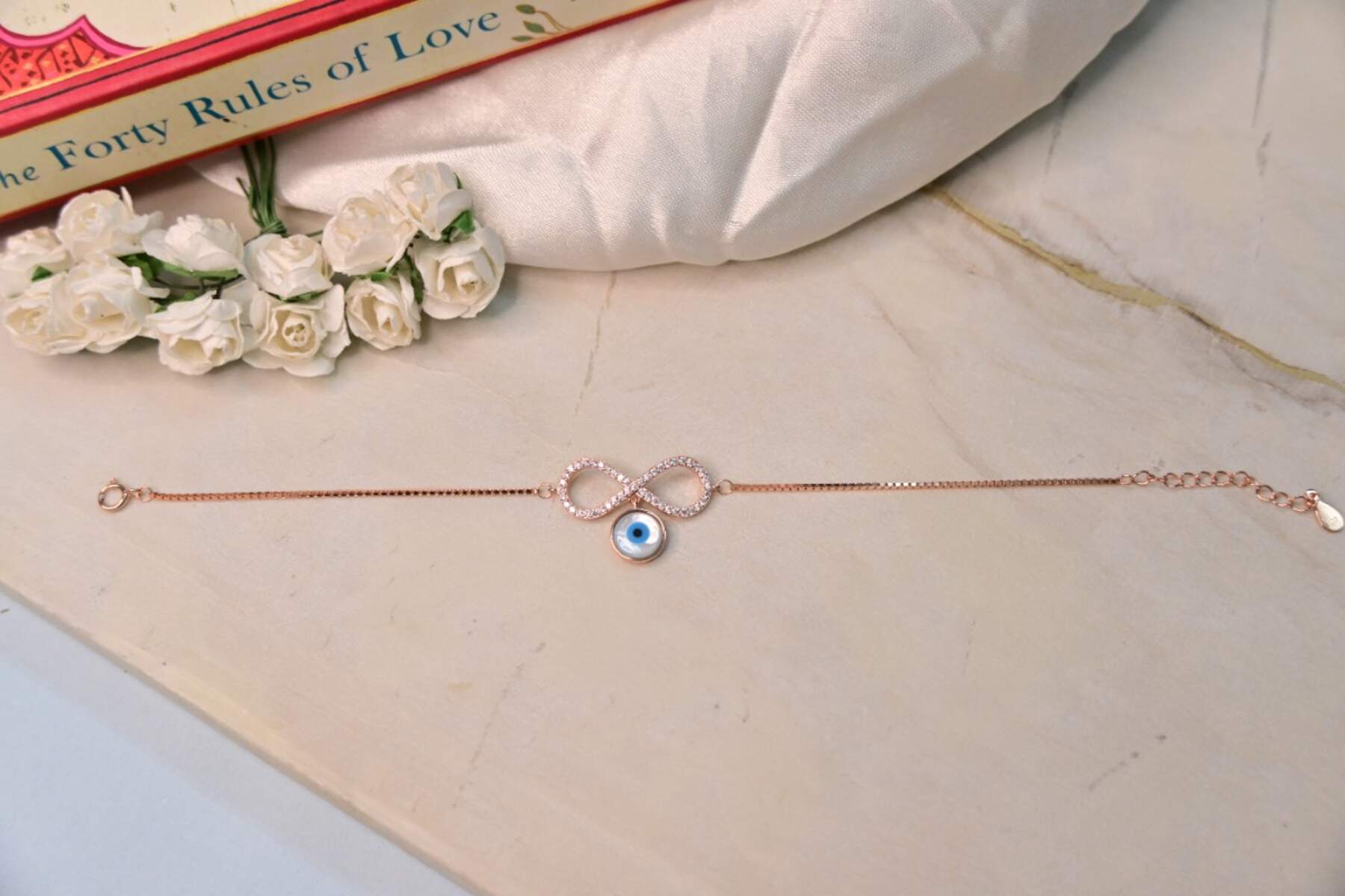 Rose Gold Infinity with Evil Eye Charm