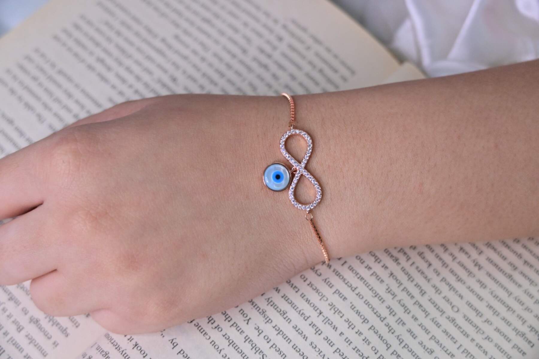 Rose Gold Infinity with Evil Eye Charm